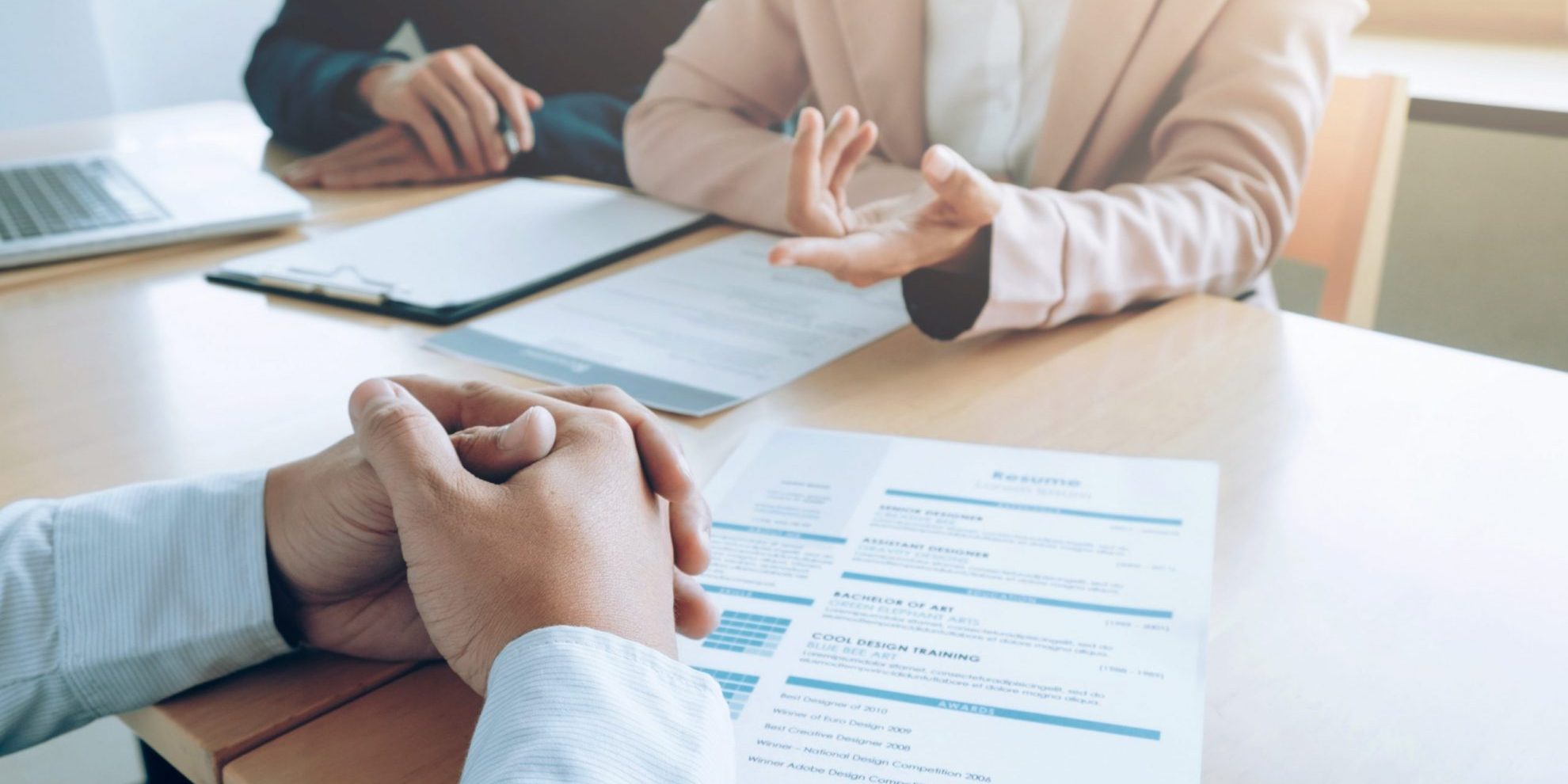 Photo of man and woman during interview illustrates blog: "Job Interviews vs Informational Interviews: What Is the Difference?"