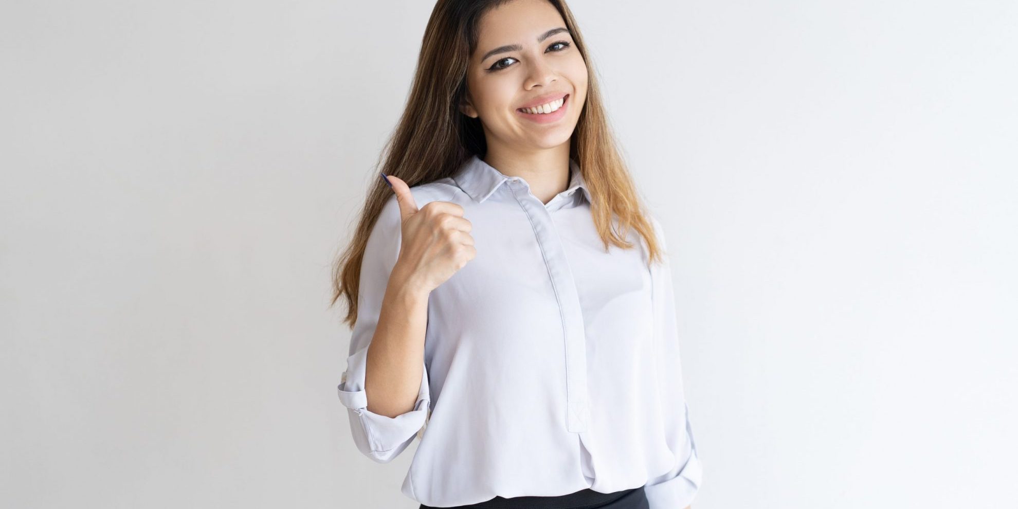 Photo of happy girl giving the thumbs up illustrates blog "5 Common Job Interview Questions and How to Answer Them"