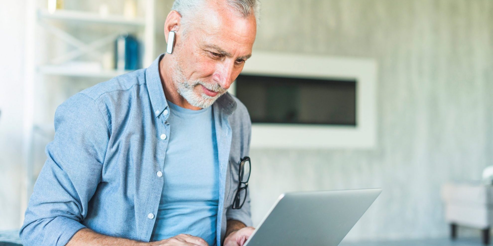 Photo of man with computer illustrates blog: "Job Trends: First Was the Great Resignation; Now It’s the Great Retirement"