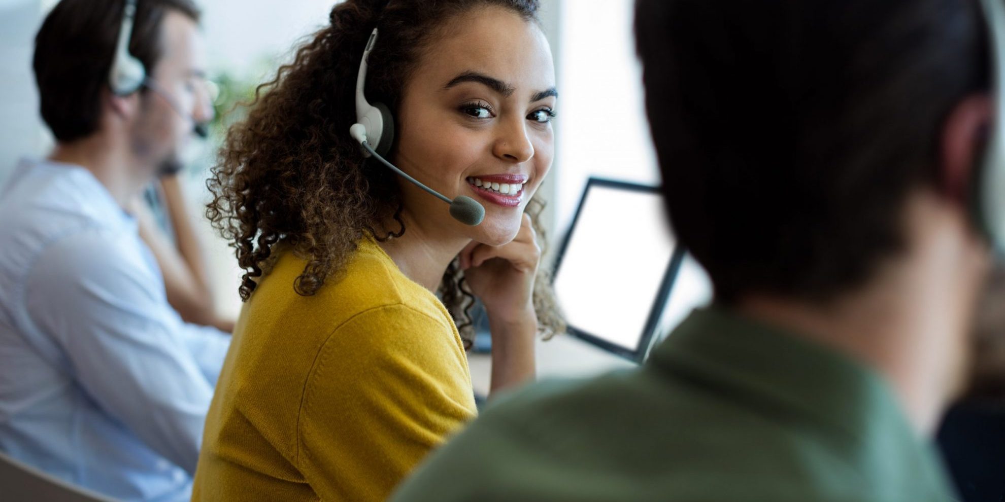 Photo of girl with headset illustrates blog: "5 Essential Call Center Job Tips"