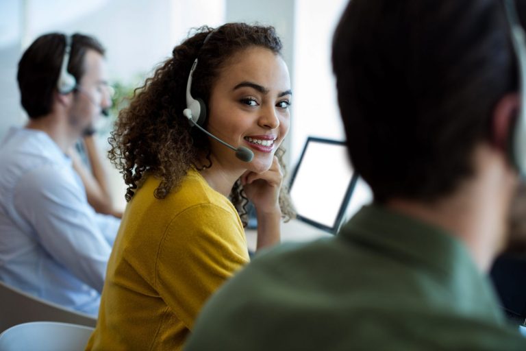 Photo of girl with headset illustrates blog: "5 Essential Call Center Job Tips"